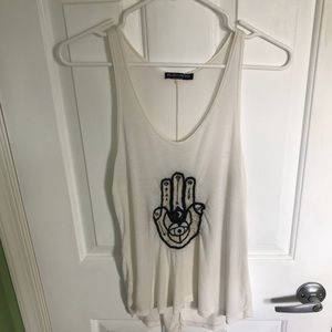 Cream colored tank top with a hamsa